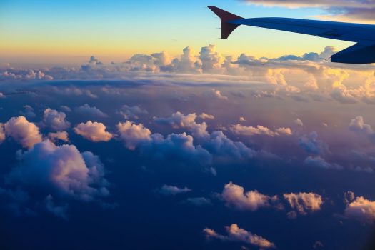 airplane wing in scenic evening sky